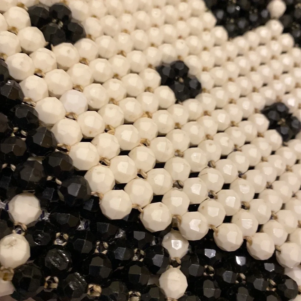 Black and white beaded shoulder beautiful bag .